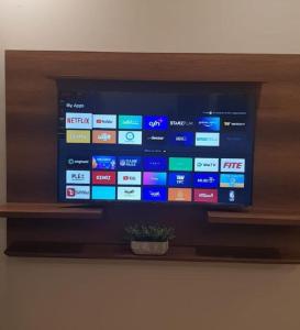 a flat screen tv sitting on a shelf at قصر الممشى للشقق الفندقية in Jazan