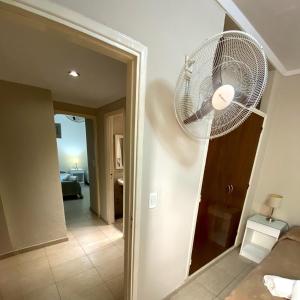 a white fan hanging on a wall in a room at Hotel Di Sorrento in Mar del Plata