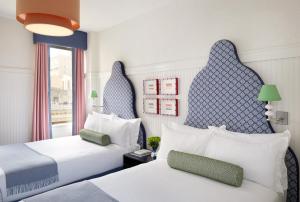 Postel nebo postele na pokoji v ubytování Hotel Triton