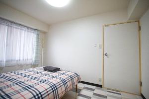 Voodi või voodid majutusasutuse 新宿市中心日式样式公寓，紧邻商业地域韩国街免费Wi-Fi toas