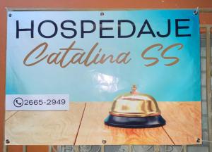 a sign for a hospected caldina restaurant at Hospedaje CatalinaSS in Liberia