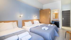 Letto o letti in una camera di Diros Hotel