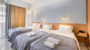 Letto o letti in una camera di Diros Hotel