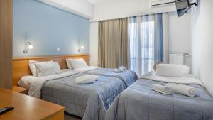 Letto o letti in una camera di Diros Hotel