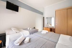 Letto o letti in una camera di Diros Hotel