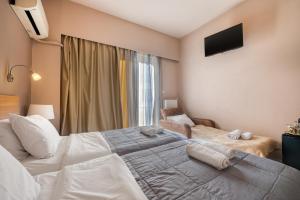 Letto o letti in una camera di Diros Hotel