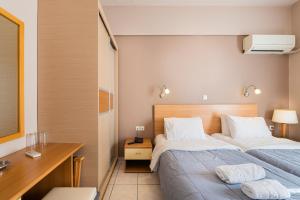 Letto o letti in una camera di Diros Hotel