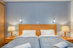 Letto o letti in una camera di Diros Hotel