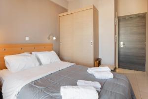 Letto o letti in una camera di Diros Hotel