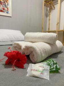 a pile of towels on the floor in a bedroom at CASA MAR DE FORA in Fernando de Noronha