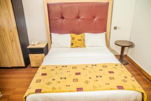 Postel nebo postele na pokoji v ubytování Hotel 61