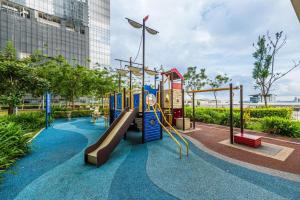 a playground in a park with a slide at Simple No 6- Trefoil Setia Alam- Near Setia Convention Centre in Shah Alam