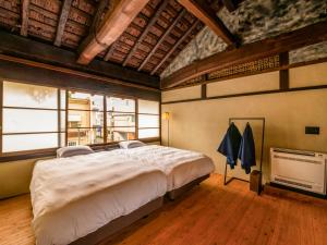Letto o letti in una camera di NIPPONIA Chichibu Monzenmachi