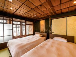 Letto o letti in una camera di NIPPONIA Chichibu Monzenmachi