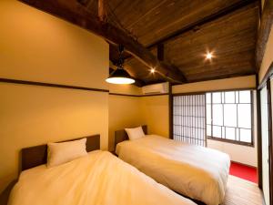 Letto o letti in una camera di NIPPONIA Chichibu Monzenmachi