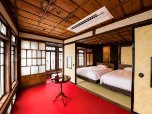 Letto o letti in una camera di NIPPONIA Chichibu Monzenmachi