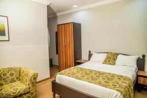 Postel nebo postele na pokoji v ubytování Hotel 61