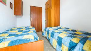 Postel nebo postele na pokoji v ubytování Apartment XXL Rio