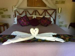 Postelja oz. postelje v sobi nastanitve The Pickled Onion B&B and Restaurant Uxmal