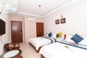 Postel nebo postele na pokoji v ubytování Kyo Hotel