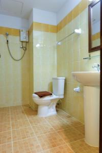 a bathroom with a toilet and a sink at Arina Boutique Residence in Chaweng