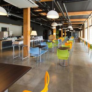 a dining room with colorful chairs and tables at Ogal Inn in Yahaba