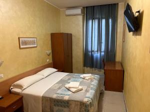 Ein Bett oder Betten in einem Zimmer der Unterkunft Hotel Tokyo