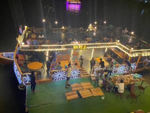 a group of people on a boat in a stage at Mama's Family Guesthouse in Kampot