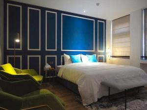 Postel nebo postele na pokoji v ubytování 小小邸 Small Hotel