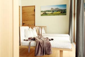 Un pat sau paturi într-o cameră la Stacherhof