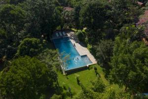 an overhead view of a swimming pool in a yard at Klov Resort & Spa in Wayanad