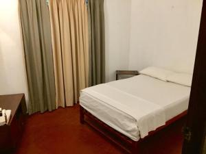 Postel nebo postele na pokoji v ubytování Galle Rest Home