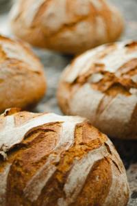 a group of loaves of bread sitting on a table at Kai 36 - Hotel zwischen Fels und Fluss in Graz