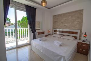 Katil atau katil-katil dalam bilik di Zehra Villas +274 gambar