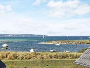 a view of a body of water with boats in it at 6 person holiday home in Wendtorf in Wendtorf