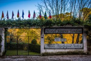 a gate to a hotel shirmka katerina pavilion with flags at Hotel Sintra Jardim in Sintra
