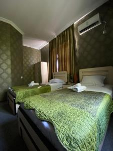 Voodi või voodid majutusasutuse Hotel Shalimar toas