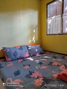 Postel nebo postele na pokoji v ubytování Chanmuang guesthouse
