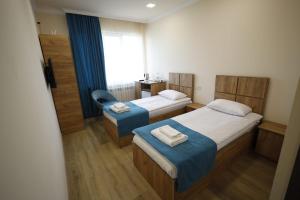Postel nebo postele na pokoji v ubytování ANGINE Resort Hotel