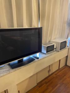 TV a/nebo společenská místnost v ubytování IslandHonu + 11 fotografií