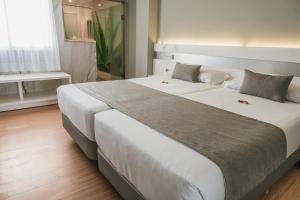 Cama o camas de una habitación en Hotel Aloe Canteras
