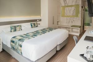Cama o camas de una habitación en Hotel Aloe Canteras