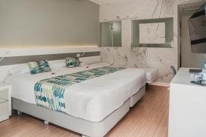 Cama o camas de una habitación en Hotel Aloe Canteras