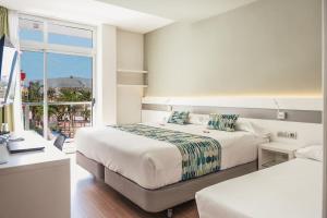 Postel nebo postele na pokoji v ubytování Hotel Aloe Canteras