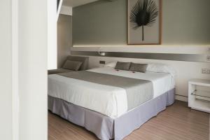 Cama o camas de una habitación en Hotel Aloe Canteras
