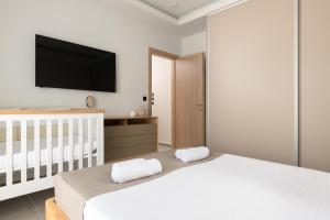 A bed or beds in a room at Mirena Luxury Living-Casa di Maria