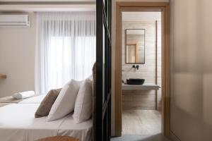 A bed or beds in a room at Mirena Luxury Living-Casa di Maria