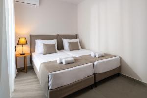 A bed or beds in a room at Mirena Luxury Living-Casa di Maria