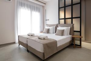 A bed or beds in a room at Mirena Luxury Living-Casa di Maria