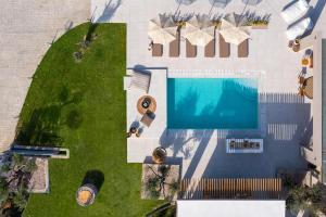 an overhead view of a swimming pool with a lawn at Casa di Maria in Afantou